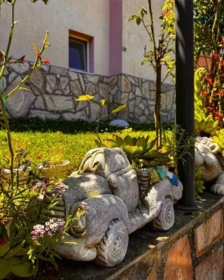 a statue of an elephant in a garden at Къща за гости Димитрови guest house Dimitrovi in Devin