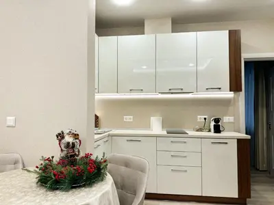 a kitchen with a table with flowers on it at Luxury Apartments 1 in Sofia