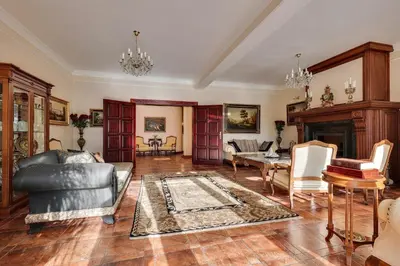 a living room with a couch and a table at AMARI PARK Residence in Golyama Zhelyazna
