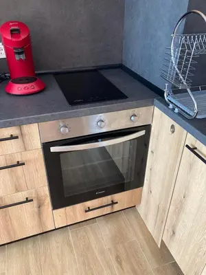 a kitchen counter with a stove and a blender at Relax Apartment in Sofia