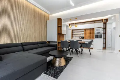 a living room with a couch and a table at Vitoshka Luxury 2-BR Retreat in Sofia