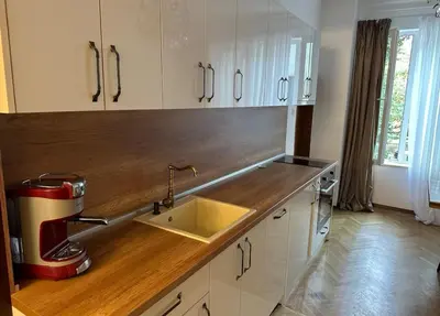 a kitchen counter with a mixer and a sink at Apartament 86 in Sofia