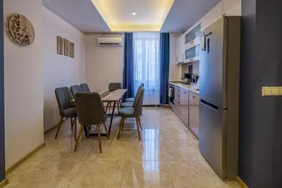 a kitchen and dining room with a table and chairs at 3BDR, Top Center Retreat, Sofia Heart, FREE Parking in Sofia
