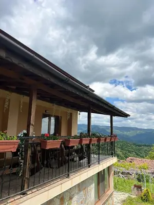 a balcony of a house with flowers on it at Villa Garden in Kremen