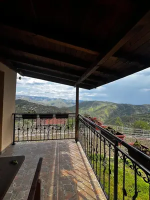 a balcony with a view of the mountains at Villa Garden in Kremen