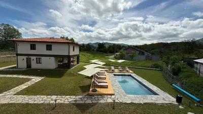 an aerial view of a house and a swimming pool at Edelweiss Oreshak in Oreshak