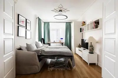a living room with a couch and a table at Aristocratic apartment with a parking spot in Sofia