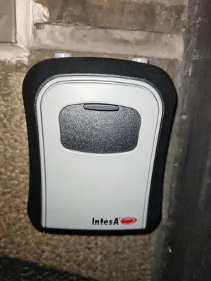 a white and black toaster sitting on a wall at Apartament 87 in Sofia