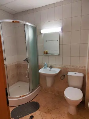 a bathroom with a shower and a toilet and a sink at Panorama Stoykite Belvedere in Stoykite