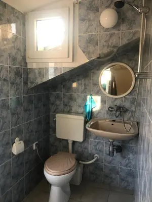 a bathroom with a toilet and a sink at TOP CENTER STUDIO - the NEST by Flat Mаnager in Sofia