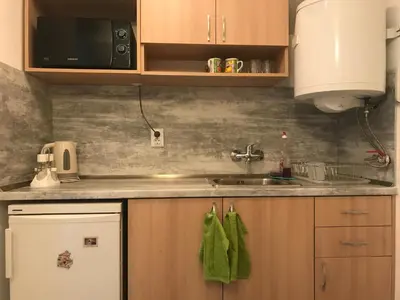 a kitchen counter with a sink and a microwave at TOP CENTER STUDIO - the NEST by Flat Mаnager in Sofia