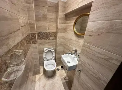 a bathroom with a toilet and a sink at Apartament 88 in Sofia