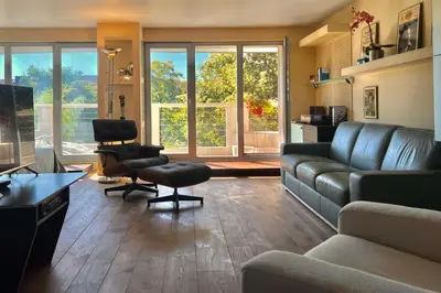 a living room with a couch and a chair at Nostalgic '90s Place Historical Center in Sofia