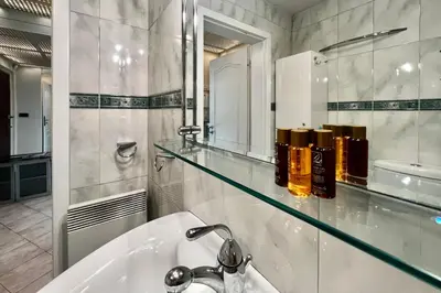 a bathroom with a sink and a mirror at Nostalgic '90s Place Historical Center in Sofia