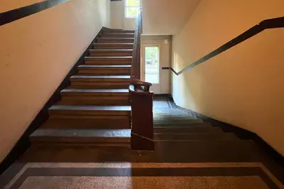 a staircase in a building with a stair case at Nostalgic '90s Place Historical Center in Sofia