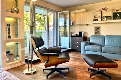 a living room with a couch and a chair at Nostalgic '90s Place Historical Center in Sofia