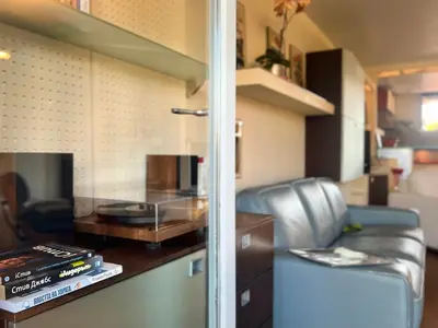 a living room with a couch and a table at Nostalgic '90s Place Historical Center in Sofia