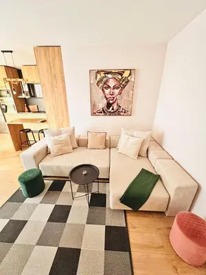 a living room with a couch and a table at Raya apartment in Plovdiv