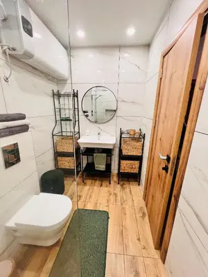a bathroom with a toilet and a sink at Raya apartment in Plovdiv