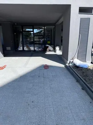 a shadow of a building with a person laying on the ground at Raya apartment in Plovdiv