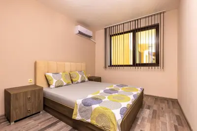 a small bedroom with a bed and a window at Modern and Cozy 1BD in the Top Centre of Plovdiv by Flat Mаnager in Plovdiv