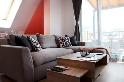 a living room with a couch and a coffee table at New Sofia Skyline 1BDRM Free Parking & Terrace in Sofia
