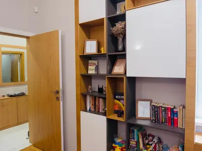 a room with a book shelf filled with books at City Center Spacious 2BR near Vitosha Blvd in Sofia