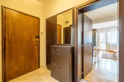 a hallway with a closet and a wooden door at Pirotska 2-Bedroom 100m2 Apartment in Sofia Center in Sofia