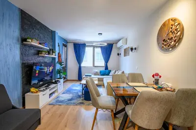 a living room with a table and chairs and a couch at Top Center Retreat, Near AUBG FREE Parking in Blagoevgrad