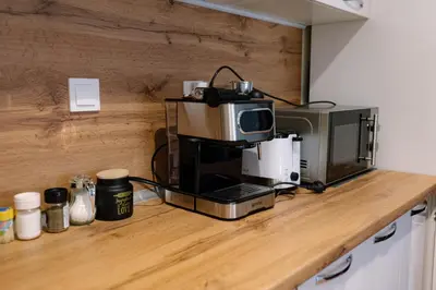 a kitchen counter with a coffee machine on a counter top at Top Center Retreat, Near AUBG FREE Parking in Blagoevgrad