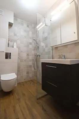 a bathroom with a shower and a toilet and a sink at INB Banishora Spot in Sofia