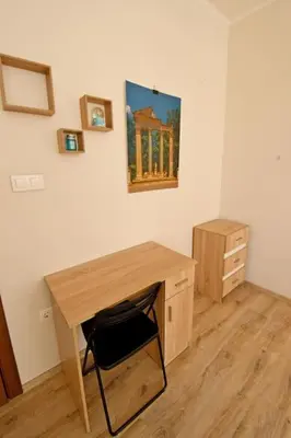 a desk and a chair in a room with a desk at Eagle's Spot in Sofia