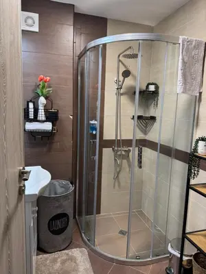 a shower with a glass door in a bathroom at Anna Lux in Bansko