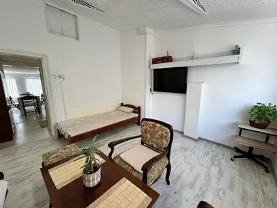 a living room with a couch and a table at Smile House in Plovdiv