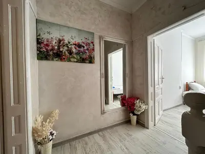 a room with a painting on the wall and a mirror at Smile House in Plovdiv