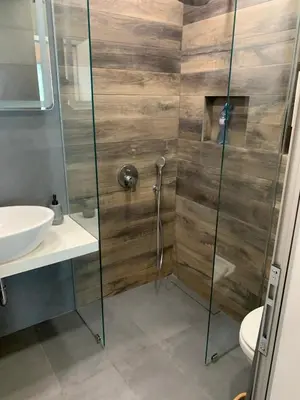 a bathroom with a shower and a sink at Kirmini apartment in Sofia