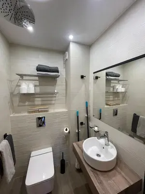a bathroom with a white toilet and a sink at Borovets Boutique Apartment Sequoia II in Borovets