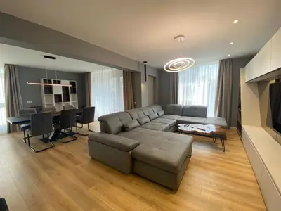a living room with a couch and a table at Gran Capital - Vodolei Park, FREE parking in Sofia