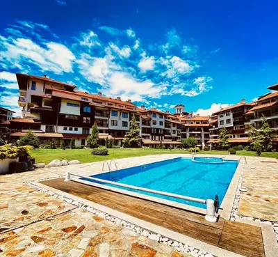 a swimming pool in front of a apartment complex at View Apartment Bansko Royal Towers in Bansko