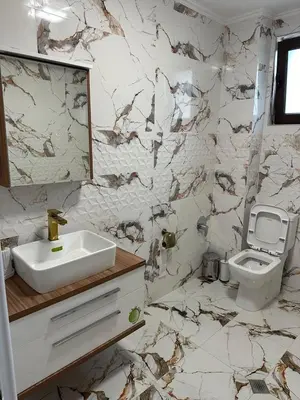 a bathroom with a sink and a toilet at The Hillside Villa in Ognyanovo