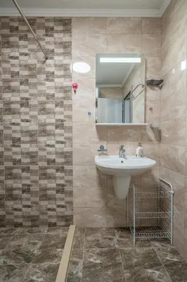 a bathroom with a sink and a mirror at Cardinal Suite in Sofia