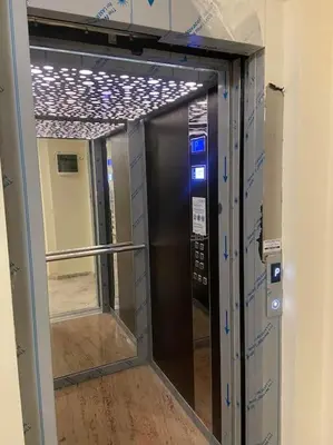 a elevator in a building with a glass door at Бутиково студио Joy-free parking in Plovdiv