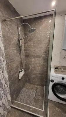a shower with a glass door in a bathroom at Diamond of Crown Bansko by Flat Mаnager in Bansko