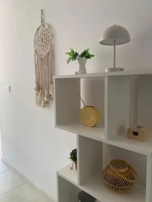 a white shelf with a lamp and a basket at Sophie Studio - Top center, Cozy & Work-Friendly near AUBG, Free streaming platforms in Blagoevgrad