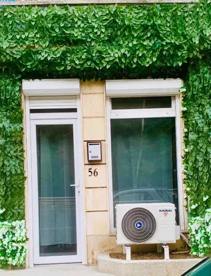 a building with a window with a microwave on it at Little Paris with Free Garage Near Tokuda Hospital in Sofia