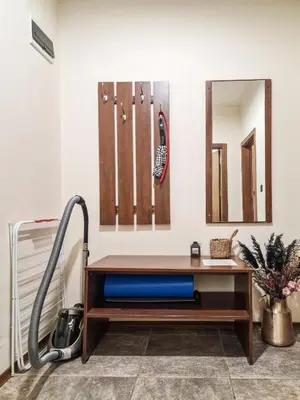 a room with a desk and a vacuum at Cosy Apartment On The Lift in Bansko