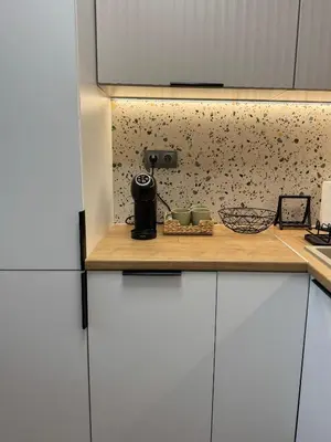 a kitchen with a counter with a camera on it at Sun Home in the Heart of Plovdiv - Central Location - Free Private Parking in Plovdiv