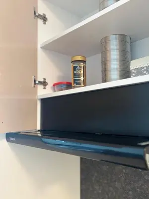 a laptop sitting on a shelf in a kitchen at MyCampus UNWE Studentski Mountain Views Modern Kitchen Equipment in Sofia