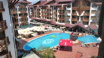 an aerial view of a swimming pool in a hotel at Pirin's Hidden Gem BB & SKI & SPA in Bansko