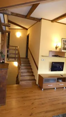 a room with a staircase and a stair case at Guest House Chepelare in Chepelare